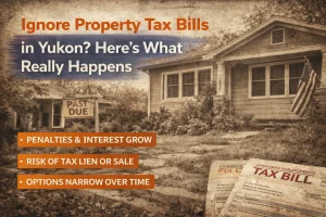 Older Yukon home with overdue property tax notice and past due sign in yard.
