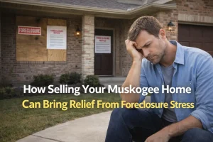 Muskogee homeowner standing in front of their house finding relief from foreclosure stress by selling their home