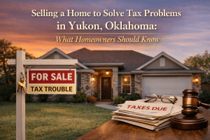 Single family home in Yukon Oklahoma with for sale sign and tax documents representing homeowners selling a house to resolve property tax problems.